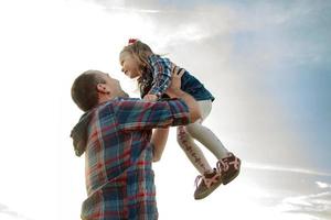 dad throws up the girl in the sky photo