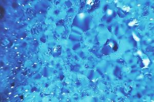 water drops on a blue background. Abstract blue background. Water drops on glass. photo