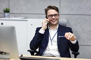 Close up portrait of businessman at workplace photo