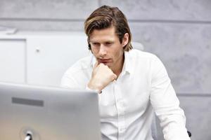 Close up portrait of businessman at workplace photo