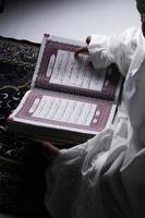 little girl reading the Quran. Islamic concept photo