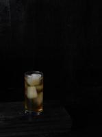 Ice tea isolated on black background photo