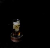 Ice tea isolated on black background photo
