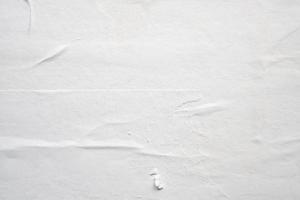 white crumpled and creased paper poster texture background photo
