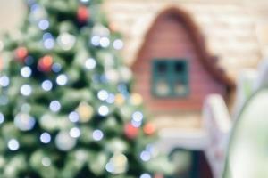 Abstract blurred christmas tree with bokeh light background photo