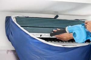 air conditioning cleaning service with air blower photo