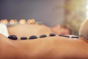 Adult happy couple relaxing in spa salon photo