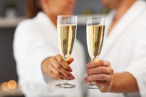 Adult happy couple relaxing in spa salon photo