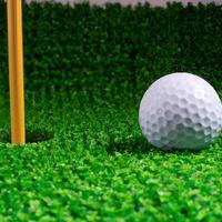 golf ball on green grass. Generative AI. photo