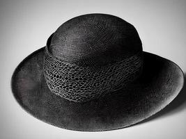 black hat on a white background. Generative AI. photo