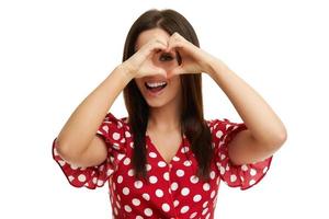 Caucasian brunette woman having fun and smiling isolated over white background photo