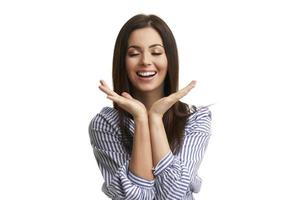 Caucasian brunette woman having fun and smiling isolated over white background photo