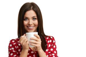 Caucasian brunette woman with mug of coffee isolated over white background photo