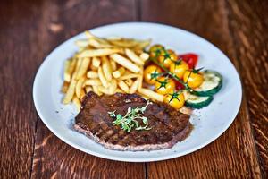 Beef barbecue steak with french fries photo