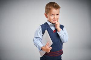 Portrait of a 4 year old boy posing over white photo