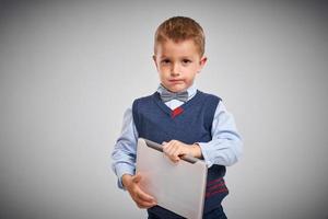 Portrait of a 4 year old boy posing over white photo