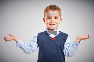 Portrait of a 4 year old boy posing over white with arrows photo