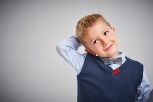 Portrait of a 4 year old boy posing over white photo