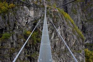 Beautiful side view on the top of via ferrata Loen Norway with suspension bridge in autumn,scandinavian nature,outdoor activity,norwegian lifestyle,print for poster,cover,calendar photo