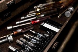 Tool box drawer with hex sockets, nut drivers, and various tools photo