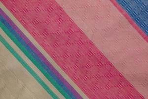 Closeup detail of multi color fabric texture samples. photo