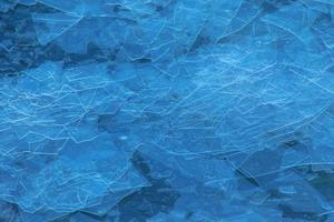 Ice surface of the river. Texture of ice shards. Winter background. photo