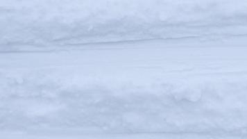 Ski run traces background Seamless Loop. Snow skiing track surface. Ski trail texture. video