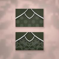 A dark green business card with a vintage white pattern for your contacts. vector