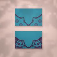 Business card in turquoise color with a vintage purple pattern for your contacts. vector