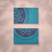 Business card in turquoise color with a mandala in purple pattern for your contacts. vector