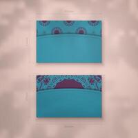 Business card template in turquoise color with a luxurious purple pattern for your contacts. vector
