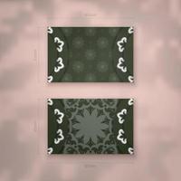 The business card is dark green with a luxurious white pattern for your contacts. vector