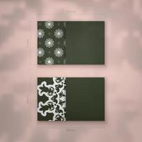 The business card is dark green with a vintage white pattern for your contacts. vector