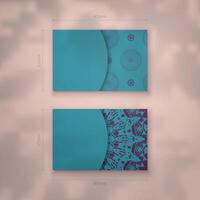 Presentable business card in turquoise color with luxurious purple pattern for your brand. vector