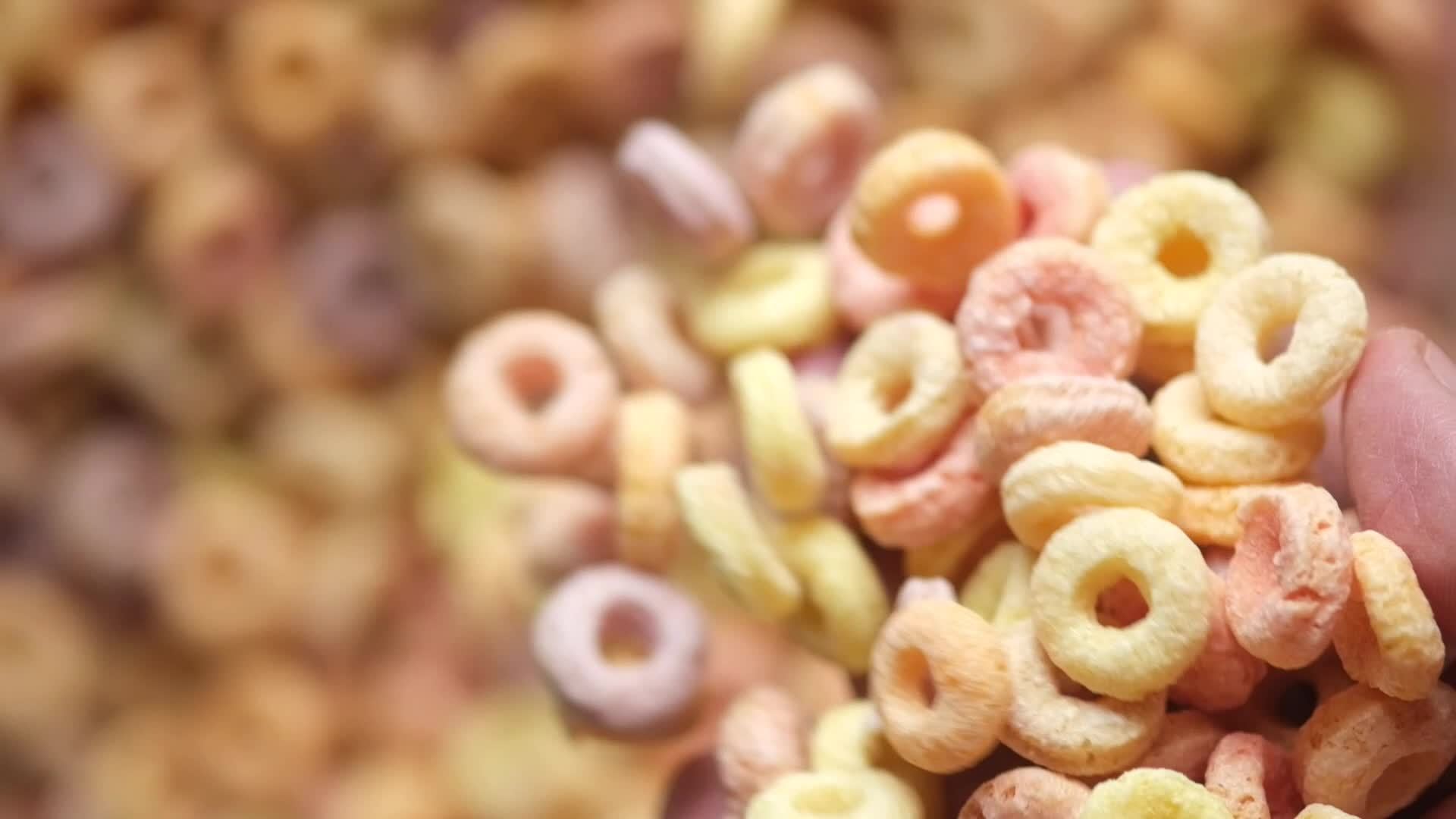 Dropping fruit circle cereal in a bowl 15808020 Stock Video at Vecteezy