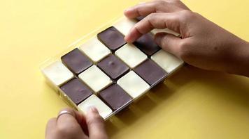 Dark and white chocolate pieces in box video