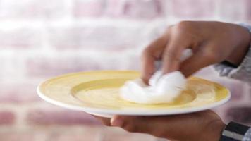 Drying a yellow plate with paper towel video