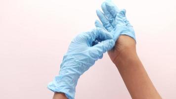 Putting on blue latex gloves video