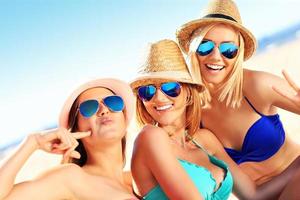 Group of women having fun on the beach photo