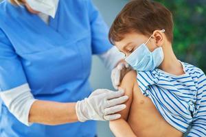 Young kids during vaccination in hospital photo