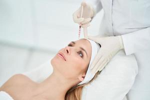 A scene of medical cosmetology treatments botox injection. photo