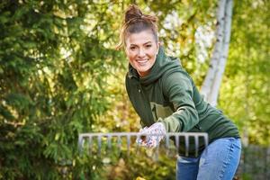 Picture of woman working with tools in the garden photo