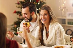 Group of friends celebrating Christmas photo