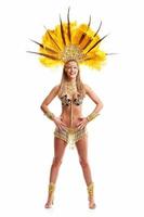 Brazilian woman posing in samba costume over white background photo