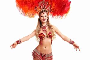 Brazilian woman posing in samba costume over white background photo