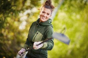 Picture of woman working with tools in the garden photo