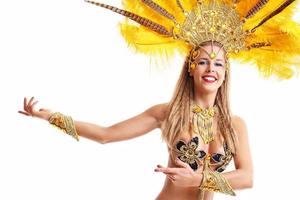 Brazilian woman posing in samba costume over white background photo