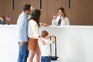 Picture of family checking in hotel photo