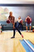 Friends playing bowling photo