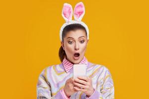 Studio shots of woman over yellow background easter style photo